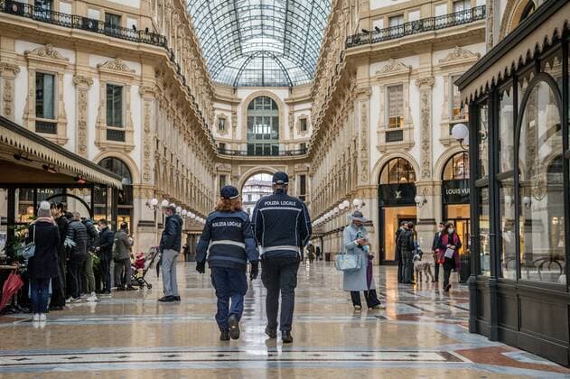 Milan. Dark Orange Zone A few people in the street through the streets of the center In the photo police in the Vittorio Emanuele gallery Editorial Usage Only  Copyright: xCarloxCozzolix xIPAx