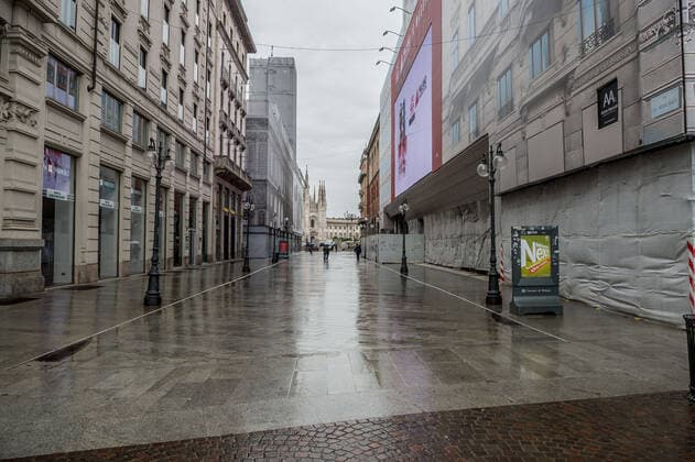 Milan. Dark Orange Zone few people in the street through the streets of the center Editorial Usage Only  Copyright: xCarloxCozzolix xIPAx