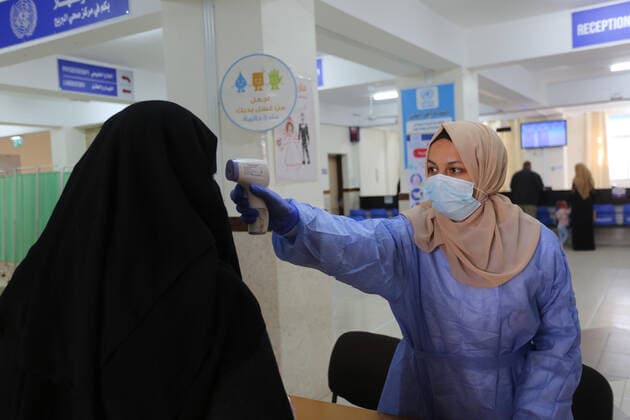 March 6, 2021, Bureij, Gaza Strip, Palestinian Territory: UNRWA employees wear face masks as the provide services in a UN clinic, in Al-Bureij camp in the central Gaza Strip, on March 6, 2021. UNRWA said that this year, the Agency will support approximately 1.25 million food-insecure Palestine refugees in the oPt through emergency food aid or cash assistance. Cash-for-work opportunities will help mitigate substantial loss of livelihoods, specifically in Gaza, and emergency education support will benefit more than 330,000 UNRWA students across the oPt Bureij Palestinian Territory - ZUMAap3_ 20210306_zaf_ap3_137 Copyright: xAshrafxAmrax