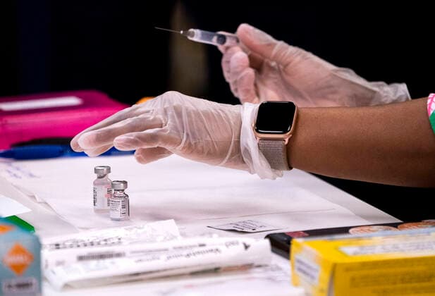 A medical worker prepares a COVID-19 vaccine as United States President Joe Biden visits a Veterans Affairs (VA) COVID-19 vaccine center in Washington, DC on Monday, March 8, 2021. Copyright: xKevinxDietschx xPoolxviaxCNPx MediaPunchx