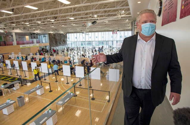 March 8, 2021, Toronto, on, Canada: Ontario Premier Doug Ford tours a COVID-19 mass vaccination clinic in Toronto on Monday, March 8, 2021. Toronto Canada  - ZUMAc35_ 20210308_zaf_c35_044 Copyright: xFrankxGunnx