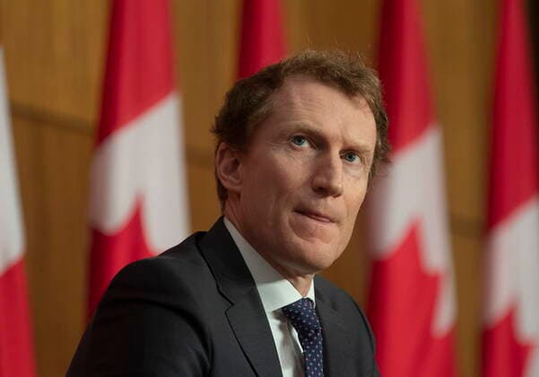 March 10, 2021, Ottawa, on, Canada: Indigenous Services Minister Marc Miller looks at a slide projected on a screen during a news conference in Ottawa, Wednesday March 10, 2021. Ottawa Canada  - ZUMAc35_ 20210310_zaf_c35_004 Copyright: xAdrianxWyldx