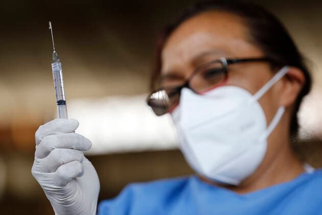March 10, 2021, Uruapan, Michoacan, Mexico: A nurse prepares a dose of Pfizer-BioNTech Covid-19 vaccine before inject to an elderly, during mass vaccine inside of Hermanos Lopez Rayon sports center, a designated priority vaccination center for elderly over 60 years in the Uruapan town. On March 10, 2021 in Michoacan, Mexico. Uruapan Mexico - ZUMAe321 20210310_zia_e321_003 Copyright: xCarlosxGuzmanx
