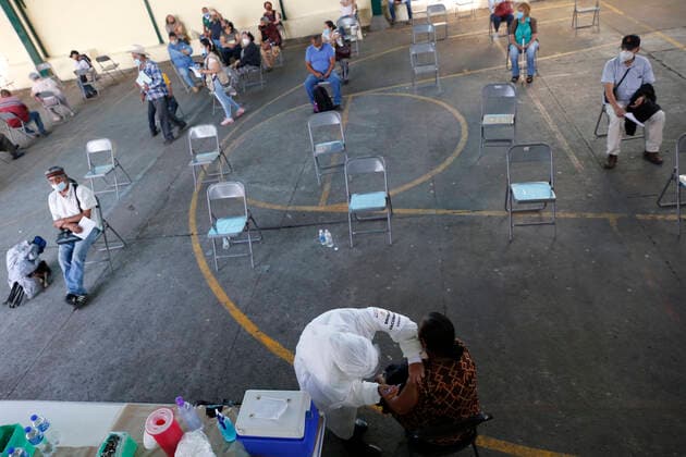March 10, 2021, Uruapan, Michoacan, Mexico: A person receives a dose of Pfizer-BioNTech Covid-19 vaccine before inject to an elderly, during mass vaccine inside of Hermanos Lopez Rayon sports center, a designated priority vaccination center for elderly over 60 years in the Uruapan town. On March 10, 2021 in Michoacan, Mexico. Uruapan Mexico - ZUMAe321 20210310_zia_e321_010 Copyright: xCarlosxGuzmanx