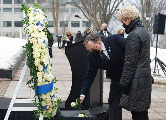 March 11, 2021, QUEBEC, PQ, Canada: Quebec Premier Francois Legault, centre, lays a rose during a ceremony for the victims of COVID-19, Thursday, March 11, 2021 at the legislature in Quebec City. Legault s wife Isabelle Brais, right, looks on. QUEBEC Canada - ZUMAc35_ 20210311_zaf_c35_044 Copyright: xJacquesxBoissinotx