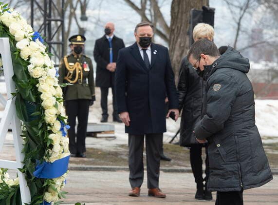 March 11, 2021, QUEBEC, PQ, Canada: Marie-Josee Chamard, who lost her mother Francoise Laurendeau, collects herself as Quebec Premier Francois Legault, centre, looks on during a ceremony for the victims of COVID-19, Thursday, March 11, 2021 at the legislature in Quebec City. QUEBEC Canada - ZUMAc35_ 20210311_zaf_c35_055 Copyright: xJacquesxBoissinotx