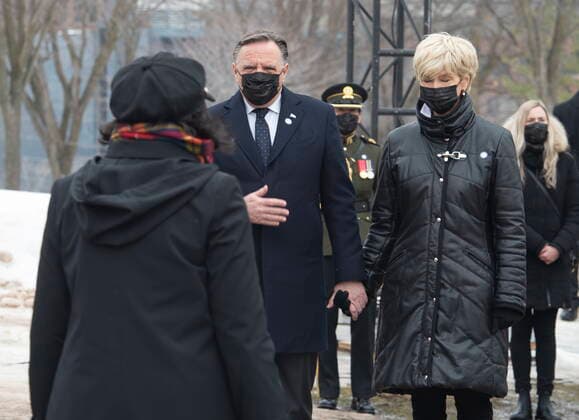 March 11, 2021, QUEBEC, PQ, Canada: Quebec Premier Francois Legault, centre, pays his respect to a family member of a victim, during a ceremony for the victims of COVID-19, Thursday, March 11, 2021 at the legislature in Quebec City. Premier Leagault s wife Isabelle Brais, right, look on. QUEBEC Canada - ZUMAc35_ 20210311_zaf_c35_058 Copyright: xJacquesxBoissinotx