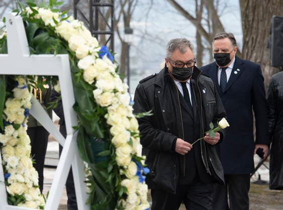 March 11, 2021, QUEBEC, PQ, Canada: Horacio Arruda, Quebec director of National Public Health, brings a rose in front of wreath during a ceremony for the victims of COVID-19, Thursday, March 11, 2021 at the legislature in Quebec City. Quebec Premier Francois Legault, behind, looks on. QUEBEC Canada - ZUMAc35_ 20210311_zaf_c35_059 Copyright: xJacquesxBoissinotx