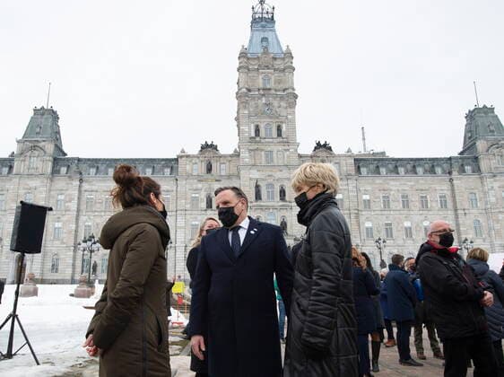 March 11, 2021, QUEBEC, PQ, Canada: Quebec Premier Francois Legault, centre, and his Isabelle Brais speak to a family member a COVID-19 victim, during a ceremony for the victims of COVID-19, Thursday, March 11, 2021 at the legislature in Quebec City. QUEBEC Canada - ZUMAc35_ 20210311_zaf_c35_060 Copyright: xJacquesxBoissinotx