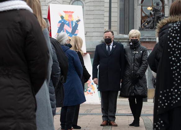 March 11, 2021, QUEBEC, PQ, Canada: Quebec Premier Francois Legault, centre, and his Isabelle Brais speak to a family member a COVID-19 victim, during a ceremony for the victims of COVID-19, Thursday, March 11, 2021 at the legislature in Quebec City. QUEBEC Canada - ZUMAc35_ 20210311_zaf_c35_061 Copyright: xJacquesxBoissinotx