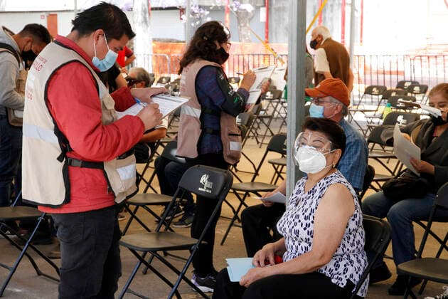 MEXICO CITY, MEXICO - MARCH 11: A worker fill a form of a elderly inside of the Autonomous Metropolitan University Azcapotzalco, previous that a health worker apply the Pfizer BioNTech Covid19 vaccine to adults over 60 years of age, in the Third Stage of Vaccination. On March 11, 2021 in in Mexico City, Mexico.. Credit: Luis Barron Eyepix Group The Photo Access Increased COVID Vaccination for Elderly in Mexico  Copyright: xLuisxBarronx