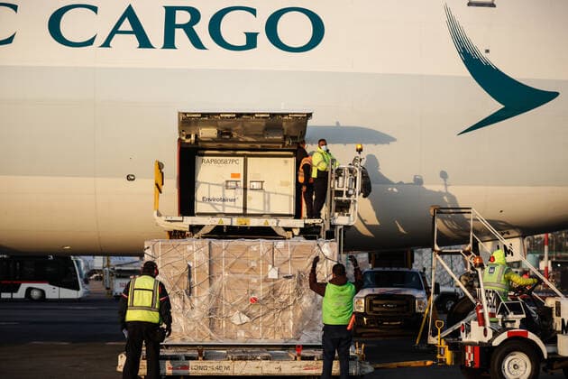 (210314) -- MEXICO CITY, March 14, 2021 -- Staff members unload a container of the COVID-19 vaccine from the Chinese pharmaceutical company Sinovac at the Mexico City s international airport in Mexico, March 13, 2021. The third shipment of the COVID-19 vaccine from the Chinese pharmaceutical company Sinovac arrived Saturday at the Mexico City s international airport. (Photo by Xinhua) MEXICO-VACCINES FROM CHINA-ARRIVAL FranciscoxCanedo 