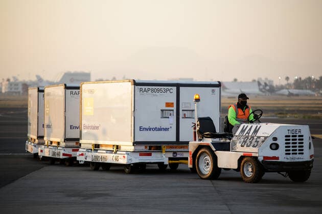 (210314) -- MEXICO CITY, March 14, 2021 -- A staff member carries containers of the COVID-19 vaccine from the Chinese pharmaceutical company Sinovac at the Mexico City s international airport in Mexico, March 13, 2021. The third shipment of the COVID-19 vaccine from the Chinese pharmaceutical company Sinovac arrived Saturday at the Mexico City s international airport. (Photo by Xinhua) MEXICO-VACCINES FROM CHINA-ARRIVAL FranciscoxCanedo 