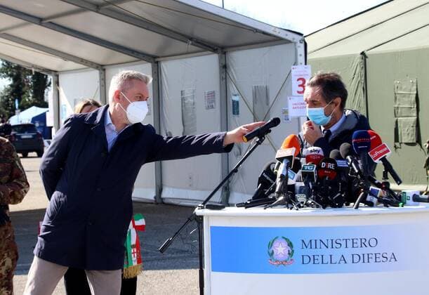 photo ipp clemente marmorino milan 15 03 2021 emergency coronavirus covid 19 inauguration of the first drive through for swabs converted into a vaccination centre in the photo the minister of defence lorenzo guerrini moves the microphone towards attilio fontana president of the lombardy region vaccination campaign drive throu  0