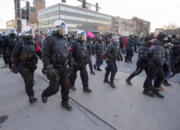 March 15, 2021, Montreal, PQ, Canada: Police keep an eye on protesters during the annual anti-police brutality demonstration in Montreal, Monday, March 15, 2021. Montreal Canada  - ZUMAc35_ 20210315_zaf_c35_098 Copyright: xRyanxRemiorzx