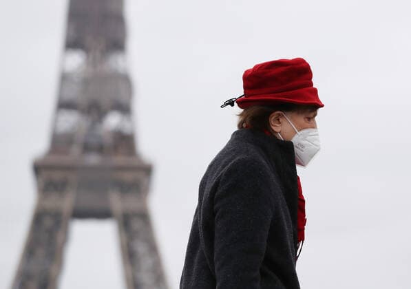 (210317) -- PARIS, March 17, 2021 -- A woman wearing a mask walks past the Trocadero Place near the Eiffel Tower in Paris, France, March 17, 2021. France has entered a form of third wave (of the coronavirus pandemic) characterized by numerous virus variants, Prime Minister Jean Castex said on Tuesday, stressing that his government still considers vaccination a top priority of its strategy to stem the spread of the virus. On Tuesday, the health authorities reported 29,975 new infections across the country, bringing the cumulative total to 4,108,108. The number of single-day deaths jumped to 408, taking the total to 91,170. ) FRANCE-PARIS-COVID-19-THIRD WAVE GaoxJing
