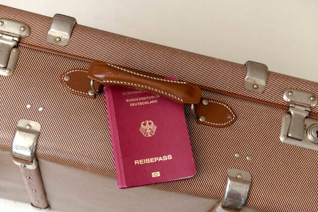 17 03 2021, Symbolic image, German passport laid out ready on a travel case 17 03 2021, Passport 17 03 2021, Passport