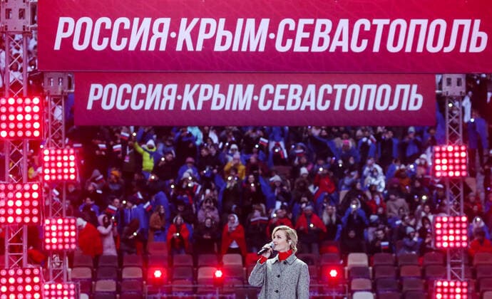 Moskau, Wladimir Putin bei Konzert zum 7. Jahrestag der Krim-Annexion MOSCOW, RUSSIA - MARCH 18, 2021: Singer Polina Gagarina performs at a concert marking the 7th anniversary of the reunification of the Republic of Crimea and the city of Sevastopol with Russia, at Luzhniki Stadium. Vyacheslav Prokofyev TASS  TS0F9C73
