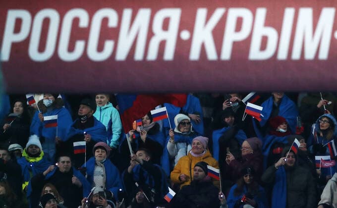 Moskau, Wladimir Putin bei Konzert zum 7. Jahrestag der Krim-Annexion MOSCOW, RUSSIA - MARCH 18, 2021: Spectators at a concert marking the 7th anniversary of the reunification of the Republic of Crimea and the city of Sevastopol with Russia, at Luzhniki Stadium. Stanislav Krasilnikov TASS  TS0F9CA0