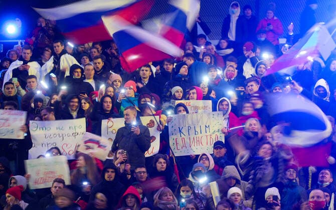 Moskau, Wladimir Putin bei Konzert zum 7. Jahrestag der Krim-Annexion MOSCOW, RUSSIA - MARCH 18, 2021: Spectators at a concert marking the 7th anniversary of the reunification of the Republic of Crimea and the city of Sevastopol with Russia, at Luzhniki Stadium. Vyacheslav Prokofyev TASS  TS0F9CB0