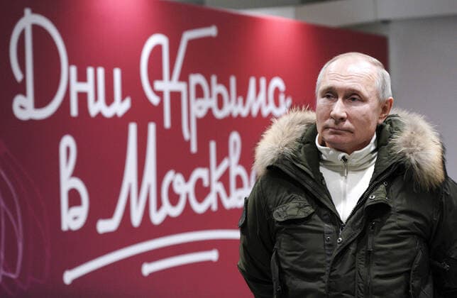 MOSCOW, RUSSIA - MARCH 18, 2021: Russia s President Vladimir Putin before walking out to the stage at a concert marking the 7th anniversary of the reunification of the Republic of Crimea and the city of Sevastopol with Russia, at Luzhniki Stadium. Alexei Druzhinin Russian Presidential Press and Information Office TASS  TS0F9CC9