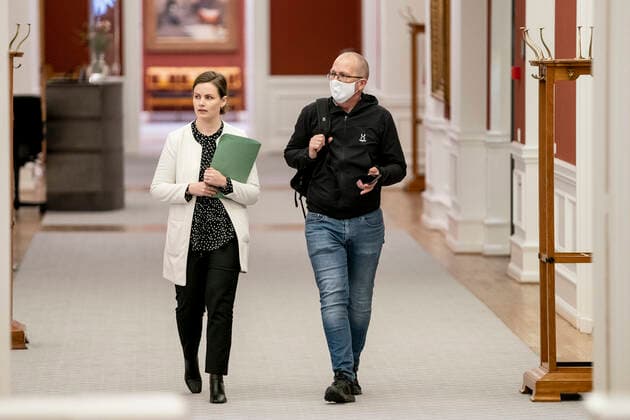 Mai Villadsen EL speaks with Peder Hvelplund EL before meeting in the Prime Ministers Office about a further reopening of the country, at Christiansborg Thursday 18 March 2021, Copenhagen Denmark  Copyright: RitzauxScanpix MadsxClausxRasmussenx cop103 spdk20210318-180931-L