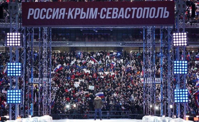 MOSCOW, RUSSIA - MARCH 18, 2021: Russia s President Vladimir Putin (C) at a concert marking the 7th anniversary of the reunification of the Republic of Crimea and the city of Sevastopol with Russia, at Luzhniki Stadium. Alexei Druzhinin Russian Presidential Press and Information Office TASS  TS0F9CF7