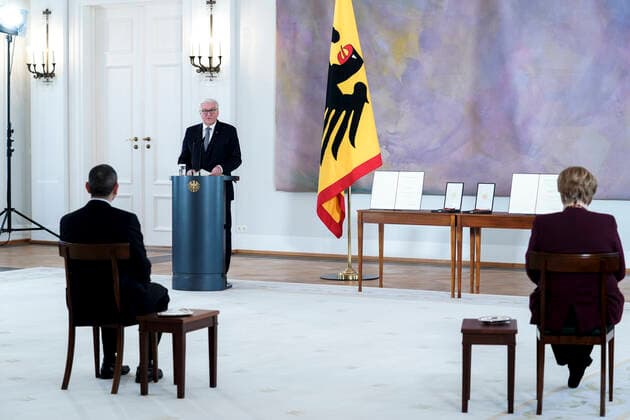Award of the Federal Cross of Merit to the Biontech Founders Current, 19 03 2021, German President Frank Walter Steinmeier during the speech in the foreground Ugur Åžahin and Chancellor Dr Angela Merkel on the occasion of the award of the Grand Cross of Merit with Star of the Order of Merit of the Federal Republic of Germany to the Biontech Founders a