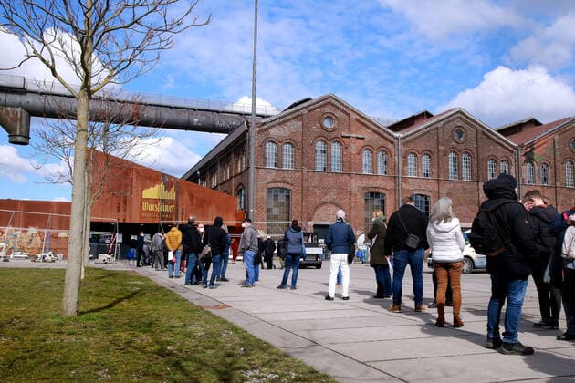 19 03 2021 Dortmund The resumption of vaccination with the vaccine Astrasenica seems to be well accepted in Dortmund A long queue of teachers willing to be vaccinated stands in front of the Dortmund vaccination centre Phoenix West to get vaccinated