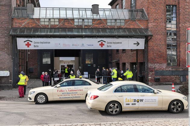 (210320) -- BERLIN, March 20, 2021 -- Two taxis park by a COVID-19 vaccination site in Berlin, capital of Germany, March 19, 2021. Germany s reported daily COVID-19 infections continued to rise sharply on Friday as the country registered 17,482 new cases in one day, the Robert Koch Institute (RKI) said on Friday. (Photo by Xinhua) GERMANY-BERLIN-COVID-19-CASES StefanxZeitz 
