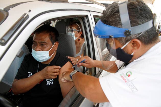 Sinovac Vaccine Is Applied To Older Adults In Their Cars In Mexico NEZAHUALCOYOTL CITY, MEXICO - MARCH 19: A health worker, injects a Sinovac Covid19 vaccine to an elderly inside a car at the Sports City Garden, in the municipality of Nezahualcoyotl in the State of Mexico, during a immunization program to drivers against Covid19. On March 19, 2021 in Nezahualcoyotl City, Mexico. Copyright: xLuisxBarronx EYEPIXGROUP_LB_19032021_5121