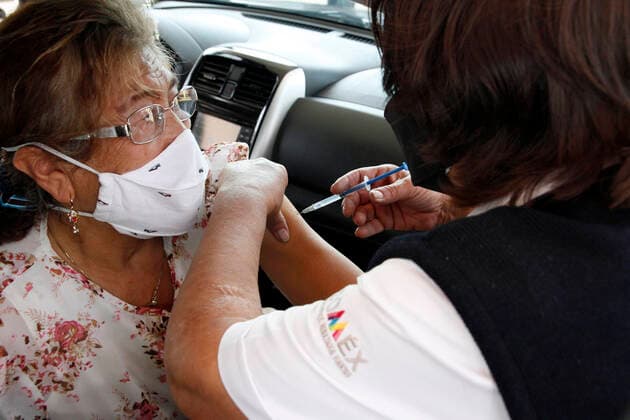 Sinovac Vaccine Is Applied To Older Adults In Their Cars In Mexico NEZAHUALCOYOTL CITY, MEXICO - MARCH 19: A health worker, injects a Sinovac Covid19 vaccine to an elderly inside a car at the Sports City Garden, in the municipality of Nezahualcoyotl in the State of Mexico, during a immunization program to drivers against Covid19. On March 19, 2021 in Nezahualcoyotl City, Mexico. Copyright: xLuisxBarronx EYEPIXGROUP_LB_19032021_5112