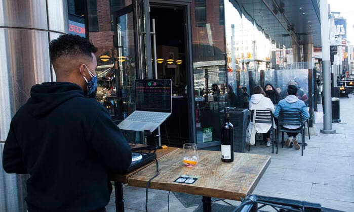 (210320) -- TORONTO, March 20, 2021 -- Customers dine as a DJ plays music at the outdoor area of a restaurant in Toronto, Canada, on March 20, 2021. With distancing rules and a number of other public health and workplace safety measures, outdoor dining was allowed to resume Saturday in Toronto under modifications to the Ontario s color-coded pandemic response framework. (Photo by Xinhua) CANADA-TORONTO-COVID-19-OUTDOOR DINING-RESUME ZouxZheng 