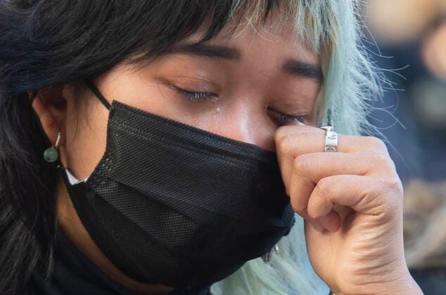 March 21, 2021, Montreal, PQ, Canada: A woman sheds tears during a vigil in Montreal, Sunday, March, 21, 2021, to highlight Asian racism and to remember the victims who were murdered in Atlanta. Montreal Canada  - ZUMAc35_ 20210321_zaf_c35_056 Copyright: xGrahamxHughesx