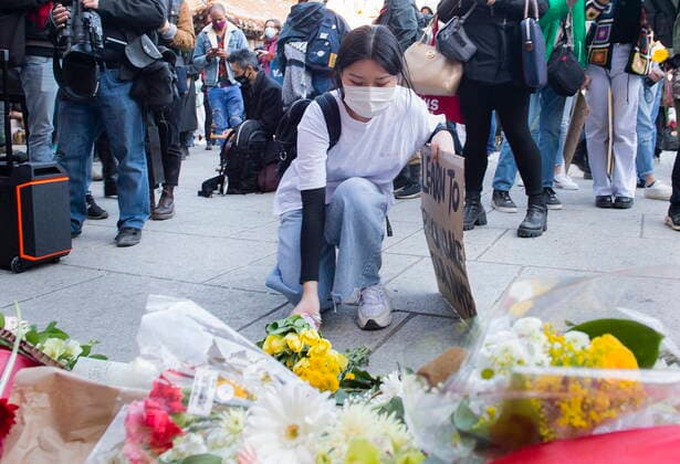 March 21, 2021, Montreal, PQ, Canada: People place flowers during a vigil to highlight Asian racism and to remember the victims who were murdered in Atlanta in Montreal, Sunday, March, 21, 2021. Montreal Canada  - ZUMAc35_ 20210321_zaf_c35_060 Copyright: xGrahamxHughesx