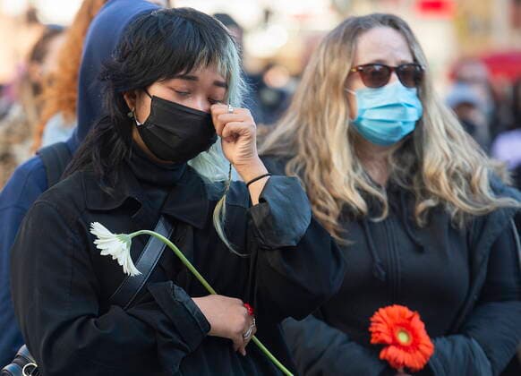 March 21, 2021, Montreal, PQ, Canada: A woman sheds tears during a vigil in Montreal, Sunday, March, 21, 2021, to highlight Asian racism and to remember the victims who were murdered in Atlanta. Montreal Canada  - ZUMAc35_ 20210321_zaf_c35_062 Copyright: xGrahamxHughesx