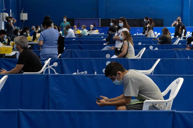 March 22, 2021, Santiago, Metropolitana, Chile: People wait to receive the dose of the Sinovac or Pfizer vaccine, in a municipal stadium transformed into a vaccination center against covid in Santiago, Chile. Santiago Chile - ZUMAb332 20210322_zip_b332_011 Copyright: xMatiasxBasualdox