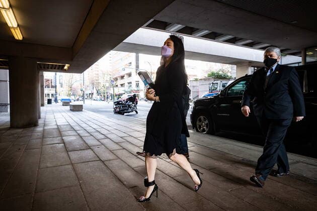 March 22, 2021, Vancouver, BC, Canada: Meng Wanzhou, chief financial officer of Huawei, carries a binder of documents as she arrives at B.C. Supreme Court, in Vancouver, on Monday, March 22, 2021. Vancouver Canada  - ZUMAc35_ 20210322_zaf_c35_017 Copyright: xDarrylxDyckx