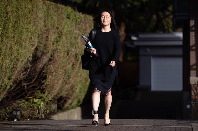 March 22, 2021, Vancouver, BC, Canada: Meng Wanzhou, chief financial officer of Huawei, carries a binder of documents as she leaves her home to attend a hearing at B.C. Supreme Court, in Vancouver, on Monday, March 22, 2021. Vancouver Canada  - ZUMAc35_ 20210322_zaf_c35_021 Copyright: xDarrylxDyckx