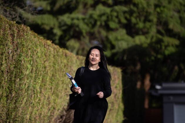 March 22, 2021, Vancouver, BC, Canada: Meng Wanzhou, chief financial officer of Huawei, carries a binder of documents as she leaves her home to attend a hearing at B.C. Supreme Court, in Vancouver, on Monday, March 22, 2021. Vancouver Canada  - ZUMAc35_ 20210322_zaf_c35_028 Copyright: xDarrylxDyckx