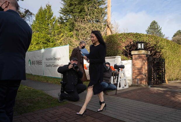 March 22, 2021, Vancouver, BC, Canada: Meng Wanzhou, chief financial officer of Huawei, carries a binder of documents as she leaves her home to attend a hearing at B.C. Supreme Court, in Vancouver, on Monday, March 22, 2021. Vancouver Canada  - ZUMAc35_ 20210322_zaf_c35_027 Copyright: xDarrylxDyckx