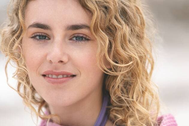 Woman standing on beach while looking at camera Close up of caucasian woman standing on beach while looking at camera, model released, Cork, Ireland, 05.02.2019, 1238803.jpg, beautiful, gen z, generation z, pretty, blonde, casual clothing, towel, standing, looking, looking at camera, smiling, wrapped, sea, ocean, beach, shore, horizon, nature, environment, tranquility, serenity, calm, peaceful, scenic, travel, travel destination, tourism, holiday, vacation, amusement, enjoyment, joy, pleasure, enjoying, having, fun, amusing, entertaining, happy, cheerful Outdoors,Close-up,Day,Head shot