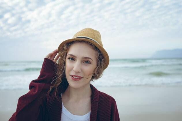Caucasian woman standing with hat on beach Portrait of beautiful young Caucasian woman standing with hat on the beach. She is smiiling and looking at camera Cork, Ireland, 05.02.2019, 1239088.jpg, beautiful, pretty, blonde, gen z, generation z, casual clothing, hat, holding, standing, looking, smiling, sea, ocean, beach, sky, cloud, cloudy, shore, wave, horizon, rock, nature, environment, tranquility, serenity, calm, peaceful, scenic, travel, travel destination, tourism, holiday, vacation Outdoors,Front view,Looking at camera,Day,Head and shoulders