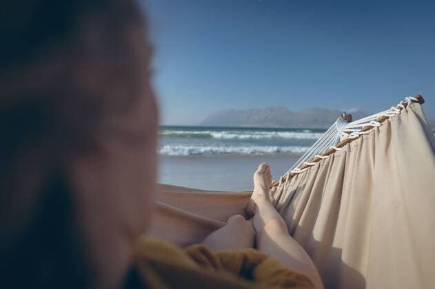 Caucasian woman relaxing on hammock while lying at beach Rear view of Caucasian woman relaxing on hammock while lying at beach on sunny day Cork, Ireland, 05.02.2019, 1239145.jpg, beautiful, blonde, pretty, gen z, generation z, sitting, leaning, looking, relaxing, thinking, thoughtful, contemplation, hammock, sea, ocean, beach, shore, wave, sand, cloud, cloudy, horizon, nature, environment, tranquility, serenity, calm, peaceful, scenic, travel, travel destination, tourism, holiday, vacation, sunny, summer Outdoors,Rear view,Day