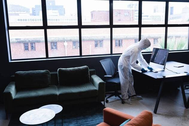 Health worker in protective clothing disinfecting creative office Health worker in protective clothing disinfecting creative office. hygiene protection in business office workplace during covid 19 coronavirus pandemic., model released, , property released, Cape Town, South Africa, 14.11.2020, 1386878.jpg, people,health,worker,protective clothing,disinfecting,creative office,office workplace,hygiene,protection,business office,workplace,covid,coronavirus,pandemic,epidemic,virus,infection,quarantine,corona,disease,flu,prevention,outbreak,mask,medical,ncov,medicine,illness,safety,protective,healthcare,care,influenza,hospital,clothing,creative,office,business Young Adult,Woman,Female,Black