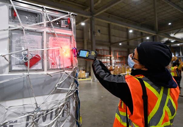 March 24, 2021, Toronto, on, Canada: A Fedex workers scans a shipment carrying 255,600 doses of the Moderna COVID-19 vaccine which came from Europe during the COVID-19 pandemic at Pearson International Airport in Toronto on Wednesday, March 24, 2021. Toronto Canada  - ZUMAc35_ 20210324_zaf_c35_004 Copyright: xNathanxDenettex