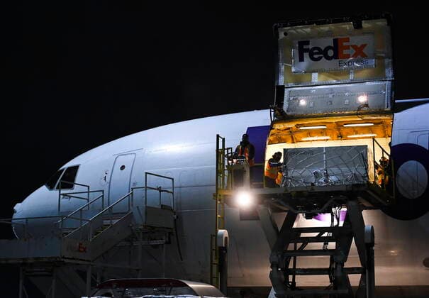 March 24, 2021, Toronto, on, Canada: FedEx workers offload a plane carrying 255,600 doses of the Moderna COVID-19 vaccine which came from Europe during the COVID-19 pandemic at Pearson International Airport in Toronto on Wednesday, March 24, 2021. Toronto Canada  - ZUMAc35_ 20210324_zaf_c35_007 Copyright: xNathanxDenettex