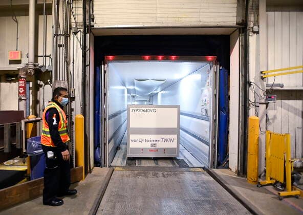 March 24, 2021, Toronto, on, Canada: A FedEx worker loads the 255,600 doses of the Moderna COVID-19 vaccine which came from Europe into a freezer trailer to be transported during the COVID-19 pandemic at Pearson International Airport in Toronto on Wednesday, March 24, 2021. Toronto Canada  - ZUMAc35_ 20210324_zaf_c35_016 Copyright: xNathanxDenettex