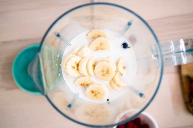Fresh bananas and milk in blender on table property released GIOF11773