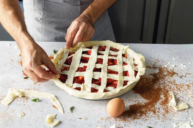 Arms of man preparing strawberry sweet pie model released Symbolfoto property released IFRF00456
